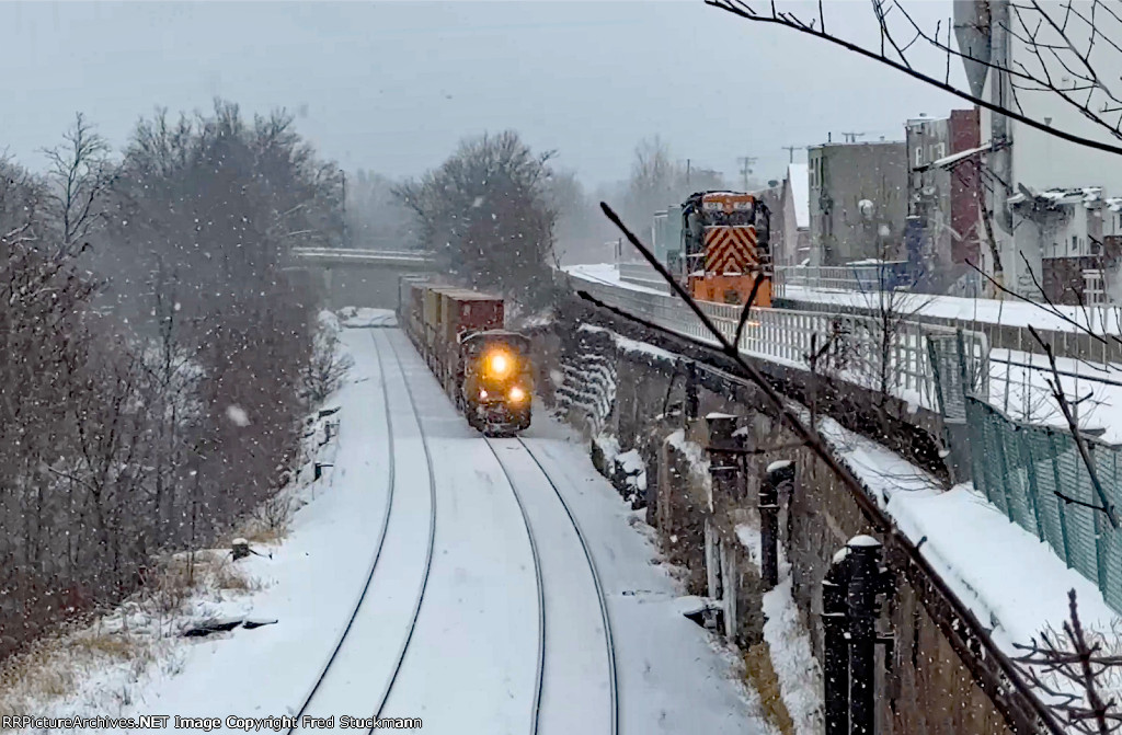 CSX 734 leads I135 west. while WE 105 heads east.